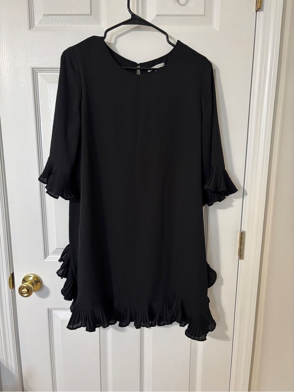 Elegant Black Mini Dress with Ruffle Hem and Sleeves